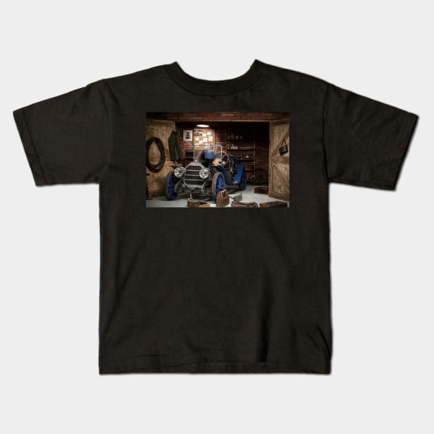 old car in the garage Kids T-Shirt by irvtolles